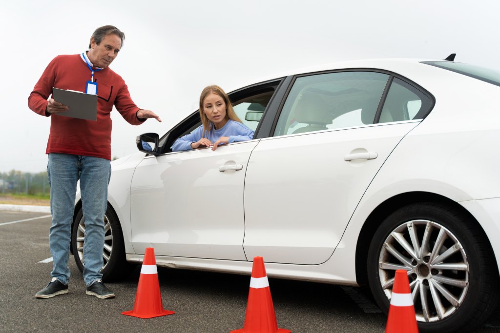 Learner driver receiving instruction from a driving teacher during their first EDT lesson in Tallaght.