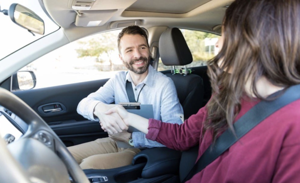 Learner driver and instructor discussing the number of driving lessons needed to pass the test in Tallaght Dublin.